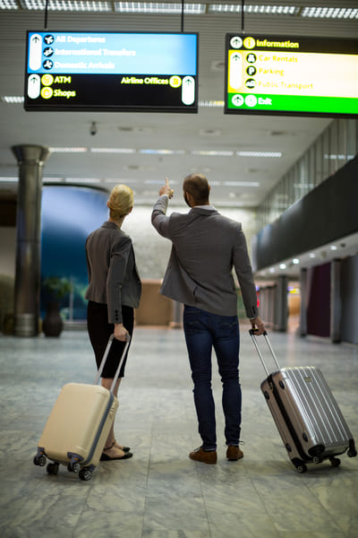 Traveler ready for departure with a Malaysia Digital Arrival Card confirmation
